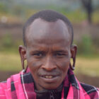 Mann im Masai Dorf